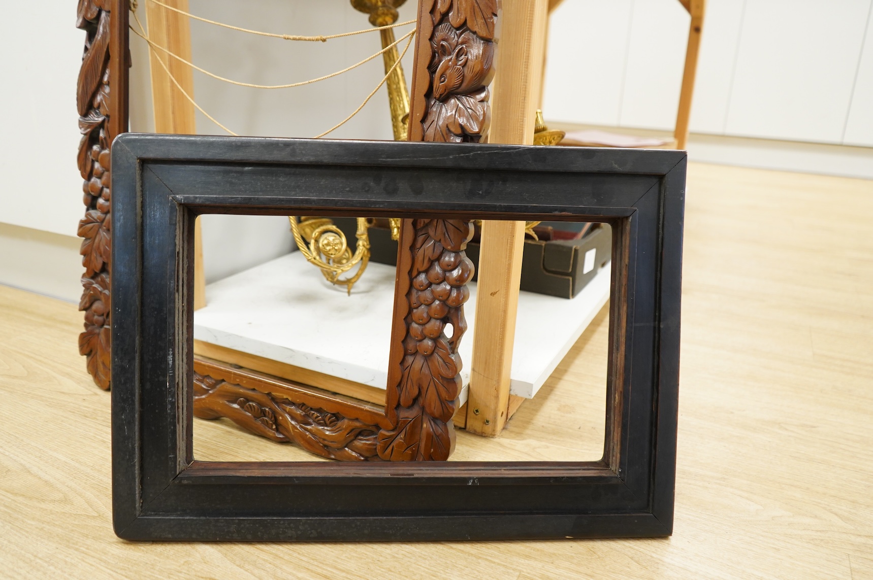 Two picture frames to include a carved wood example, aperture size 74 x 41cm